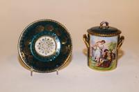 An Austrian Porcelain Painted Covered Jar Height overall 5 1/2 inches.