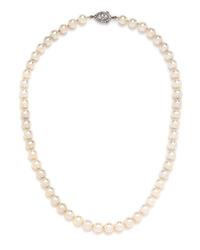 A Single Strand Cultured Pearl Necklace with a Platinum and Diamond Clasp,
