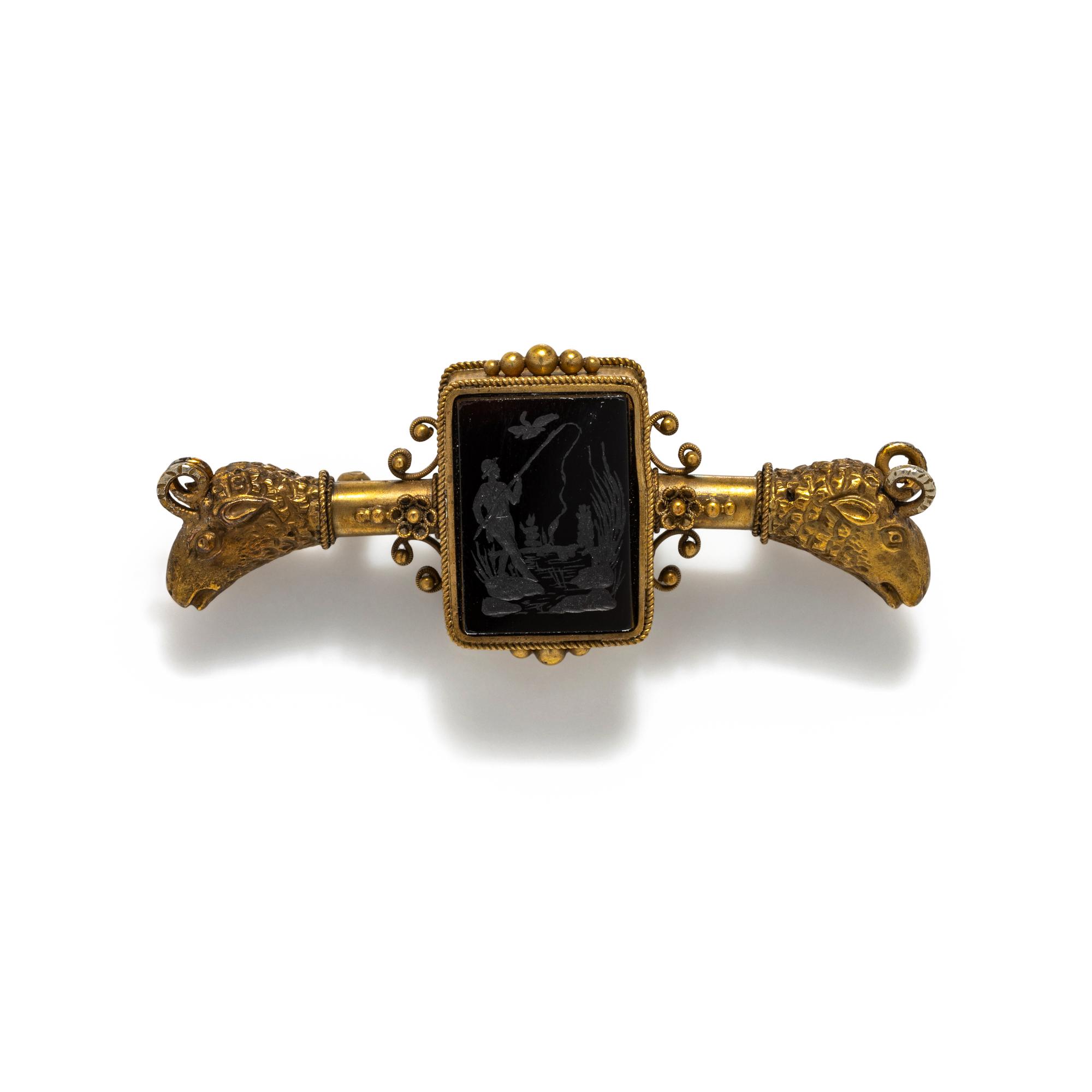 ANTIQUE, GILT AND CARVED INTAGLIO BROOCH
