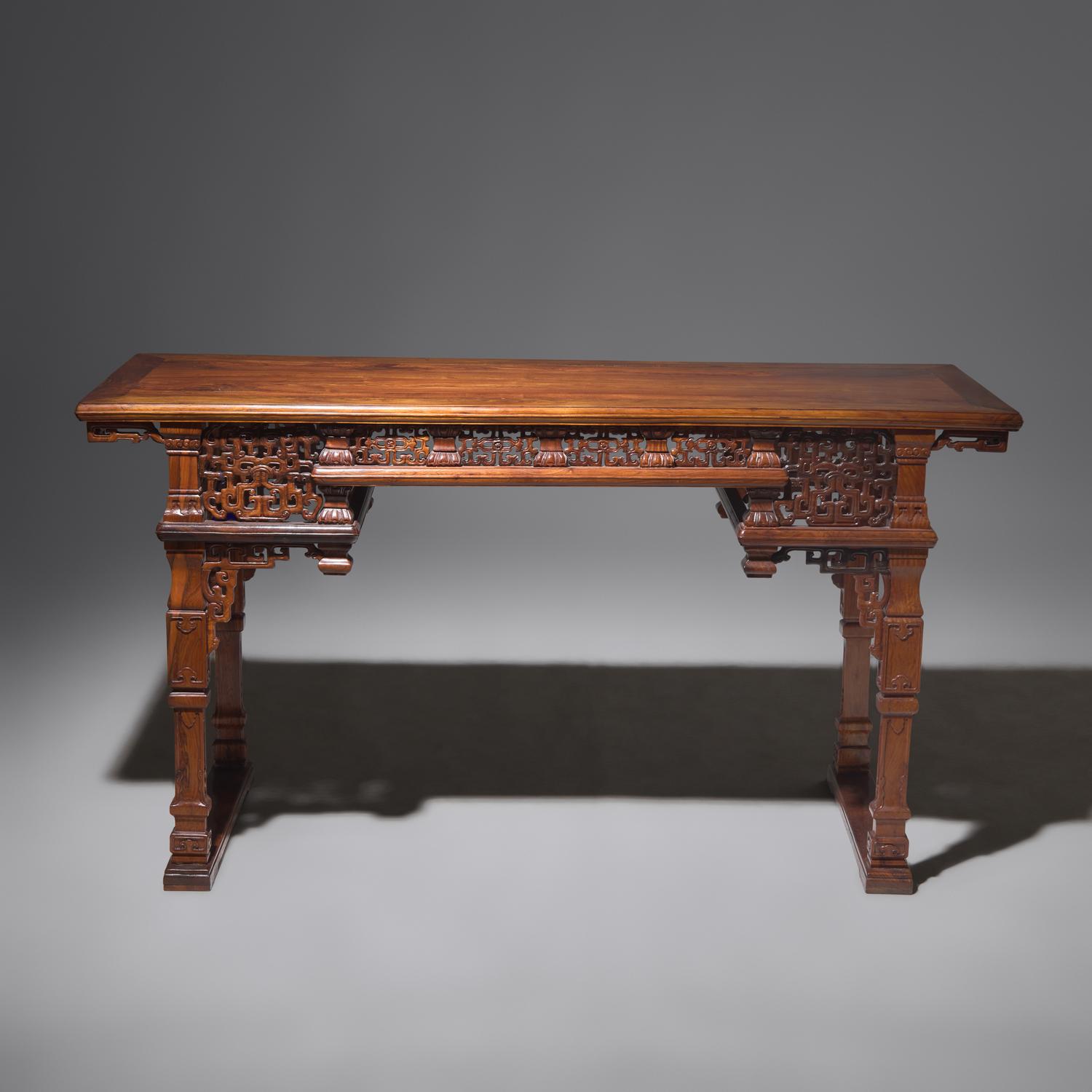 A Chinese Carved Huanghuali Side Table, Tiaozhuo, Late 19th to 20th Century 晚清民國 黃花梨透雕夔龍紋條桌