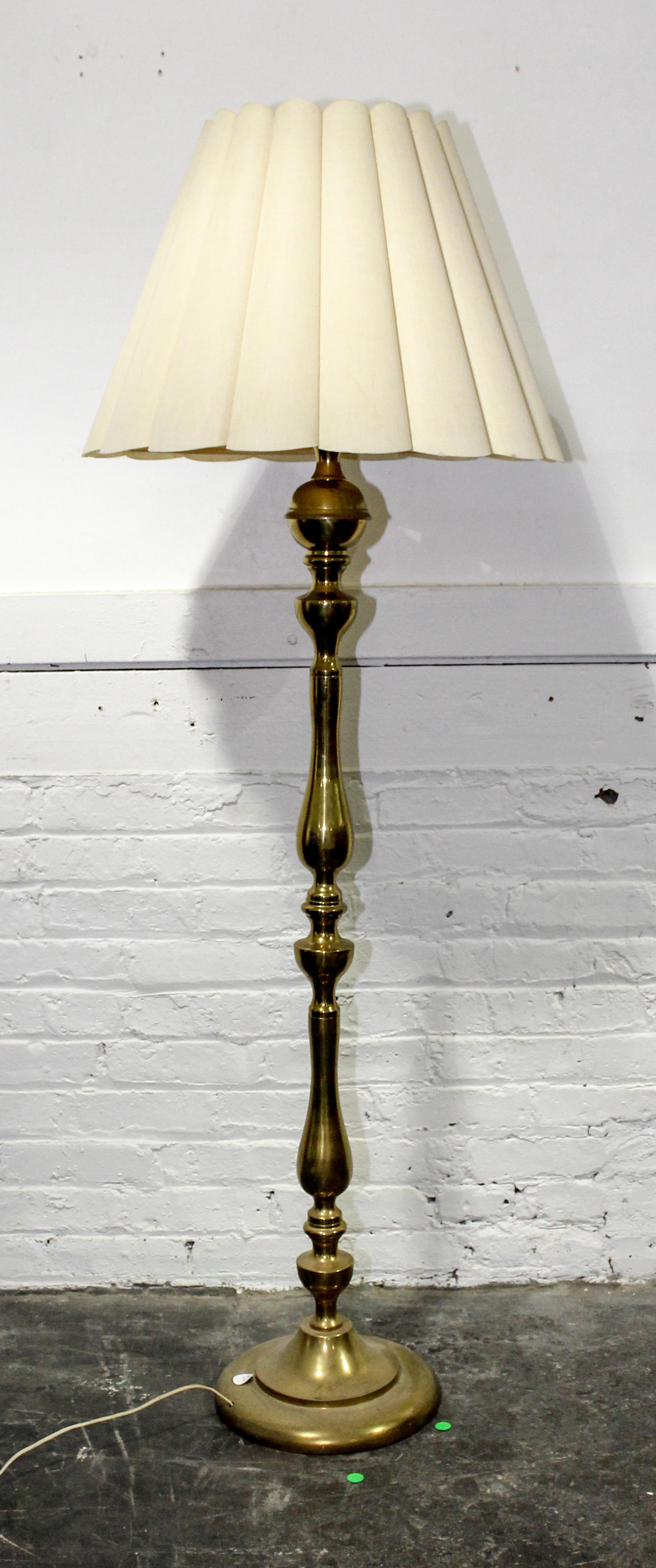 A Brass Floor Lamp. Height 60 inches.
