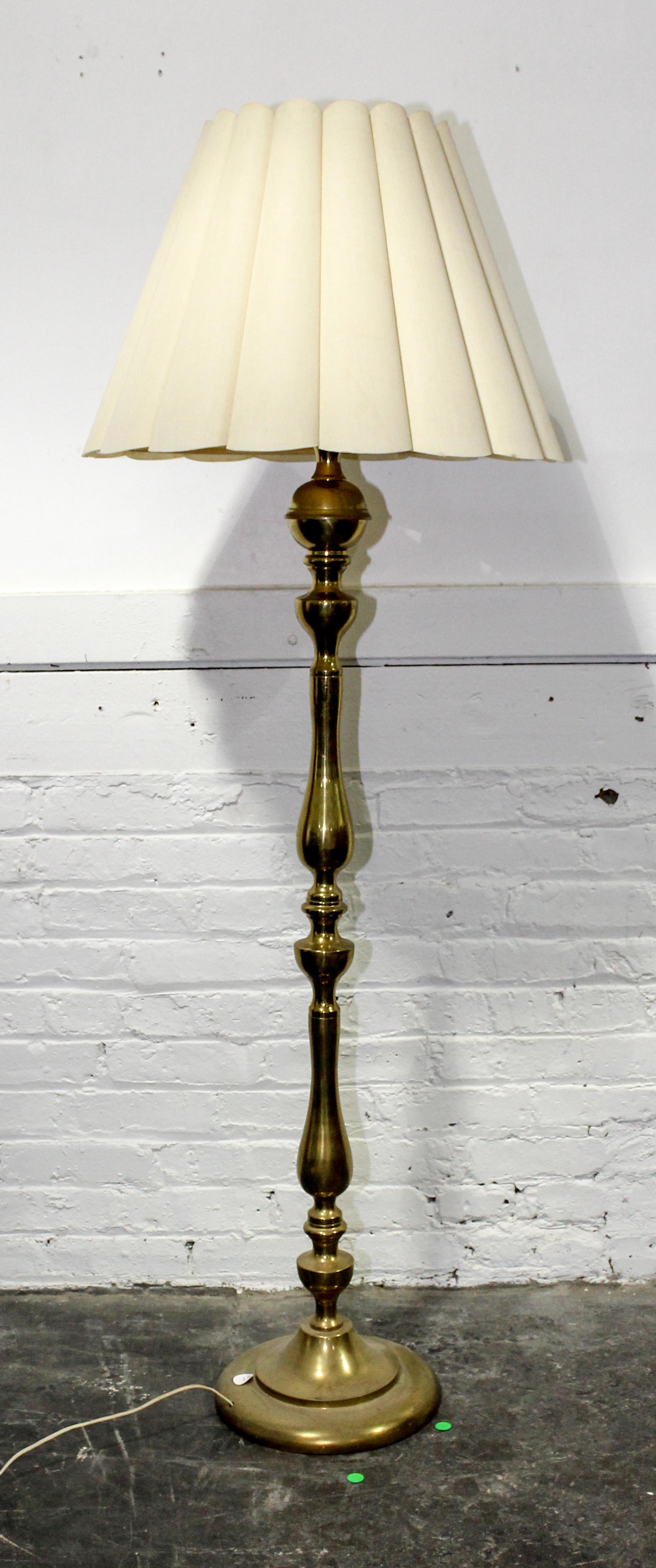A Brass Floor Lamp. Height 60 inches.