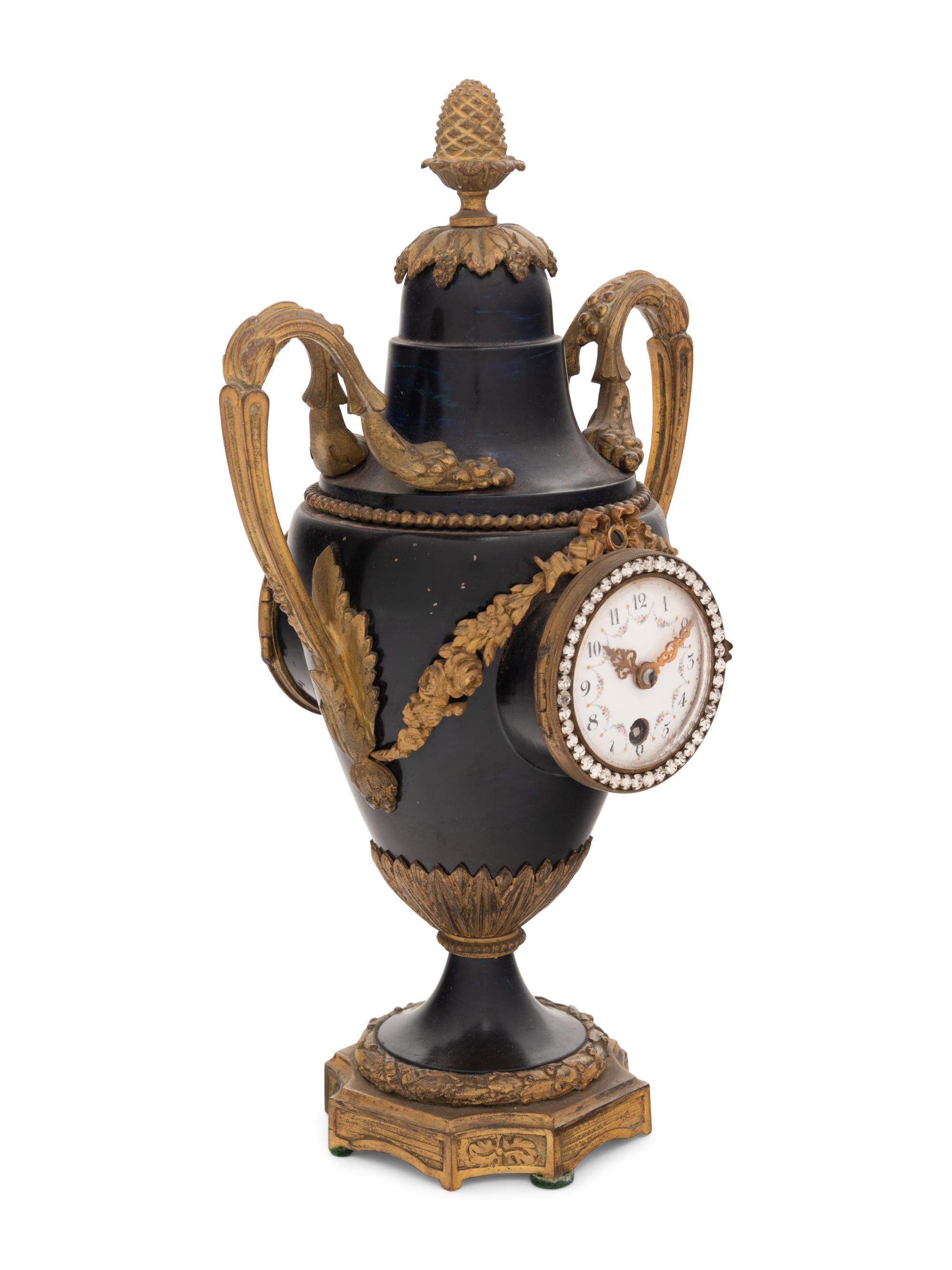 A French Gilt Bronze and Painted Tôle Clock