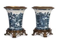A Pair of United Wilson Gilt Metal Mounted Canton Style Porcelain Urns