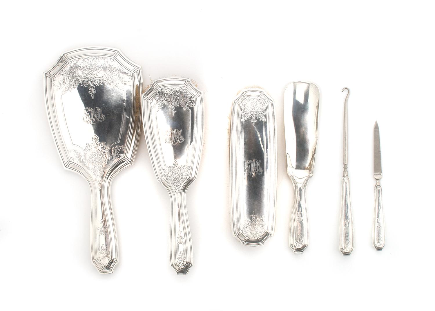 An American Sterling Silver Six Piece Dressing Set, Tiffany & Co., Length of mirror 10 3/4 inches.