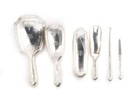 An American Sterling Silver Six Piece Dressing Set, Tiffany & Co., Length of mirror 10 3/4 inches.