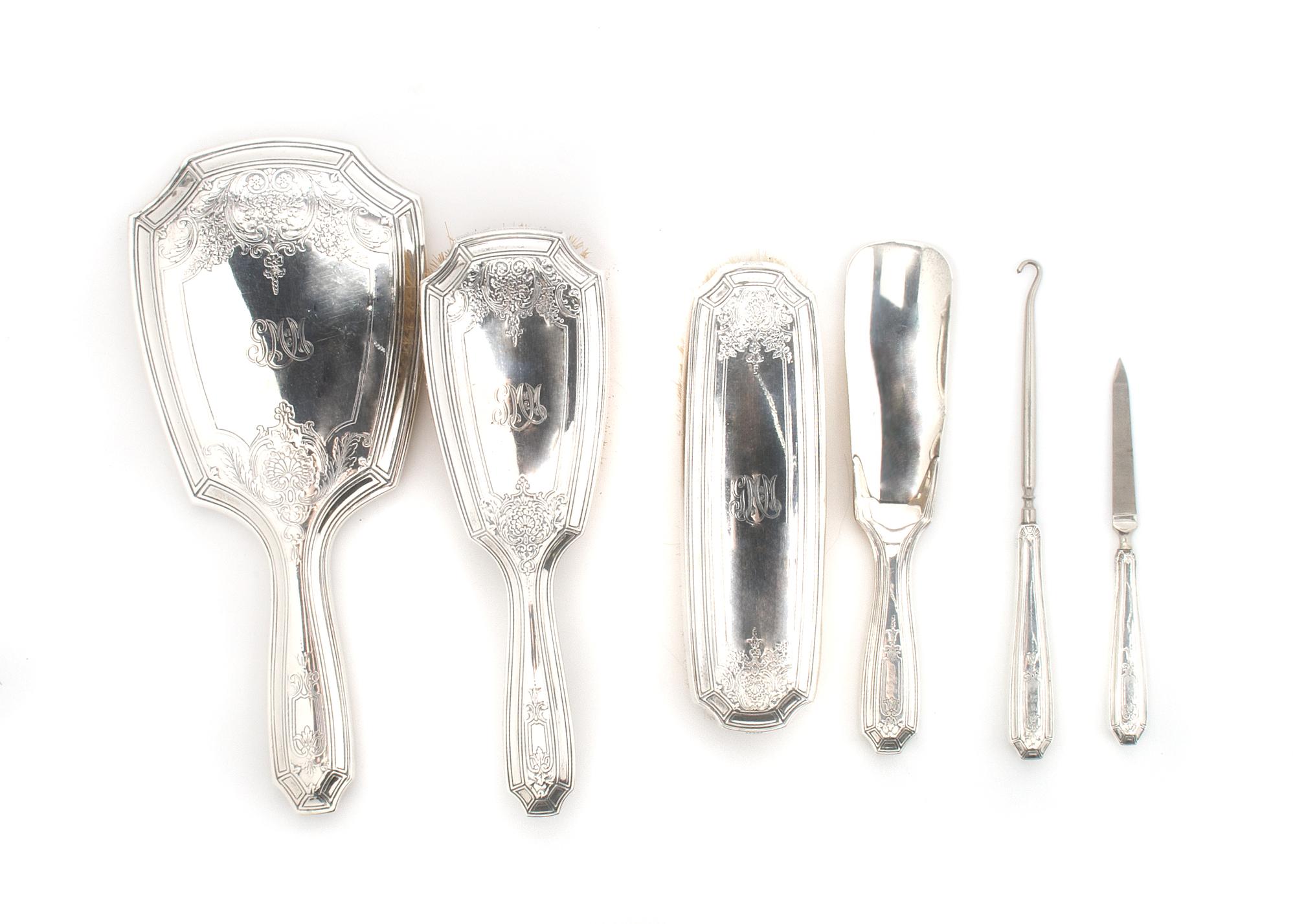 An American Sterling Silver Six Piece Dressing Set, Tiffany & Co., Length of mirror 10 3/4 inches.