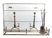 An Assembled Set of Brass Fireplace Tools, Width of fender 49 inches.