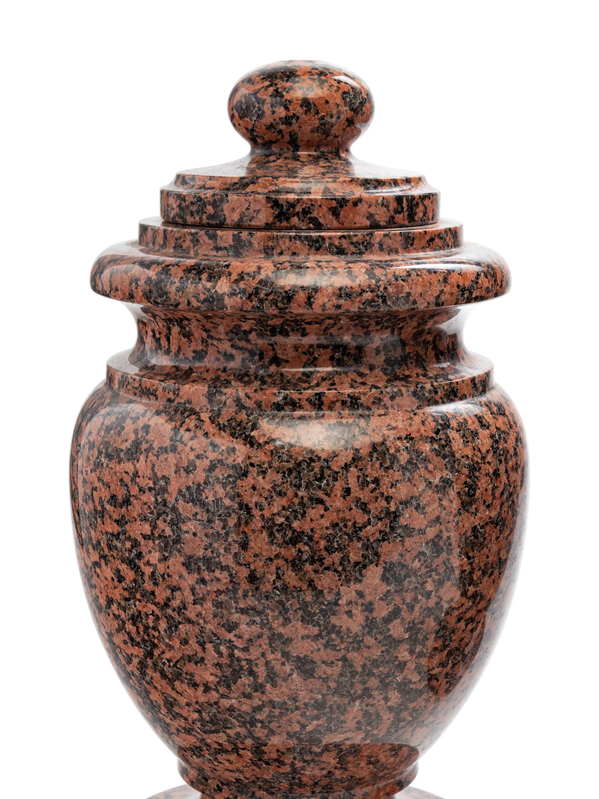 A Pair of Carved Marble Covered Urns