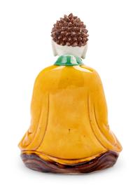 A Chinese Sancai Glazed Biscuit Figure of Buddha Shakyamuni