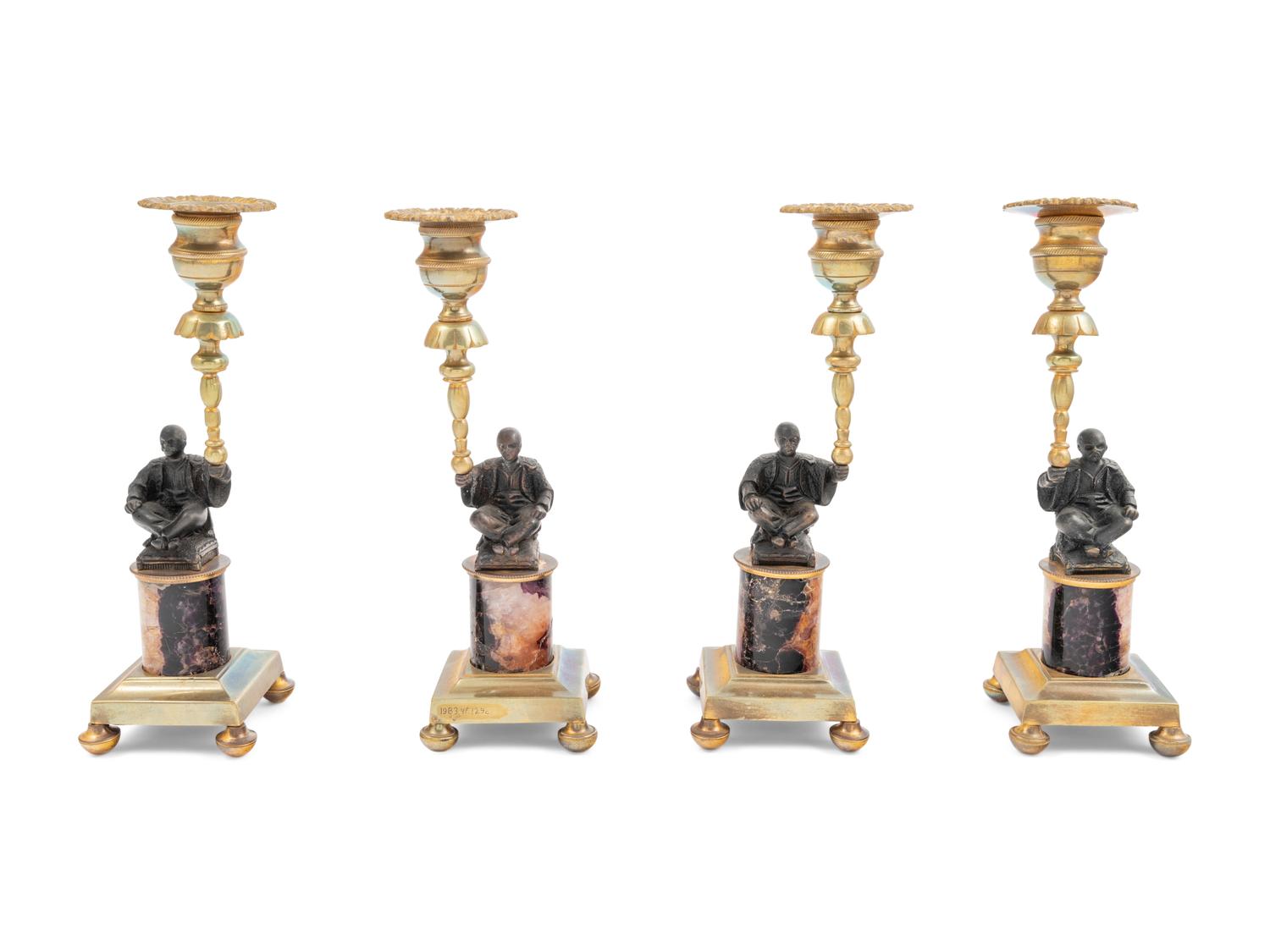 A Set of Four Gilt Metal and 'Blue John' Figural Candlesticks