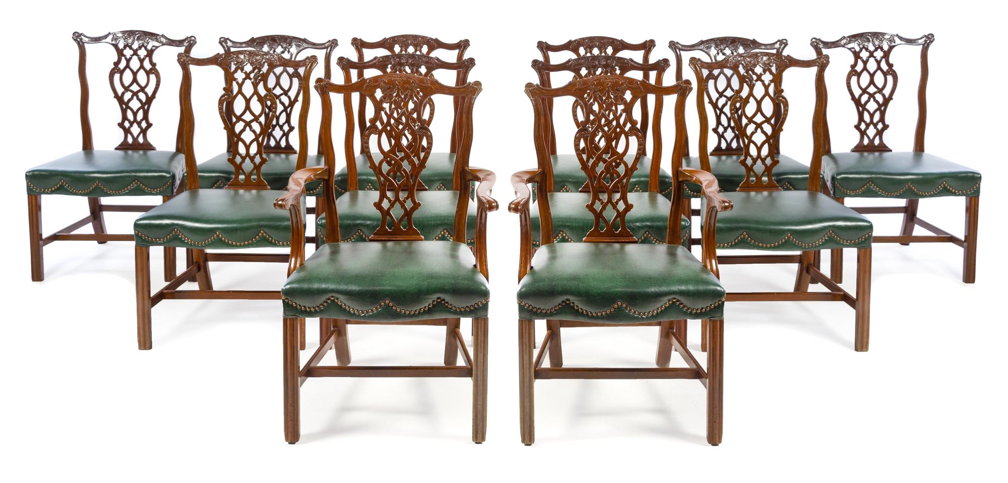 A Set of Twelve Chippendale Style Mahogany Dining Chairs Height 38 1/2 inches. — 20TH CENTURY
