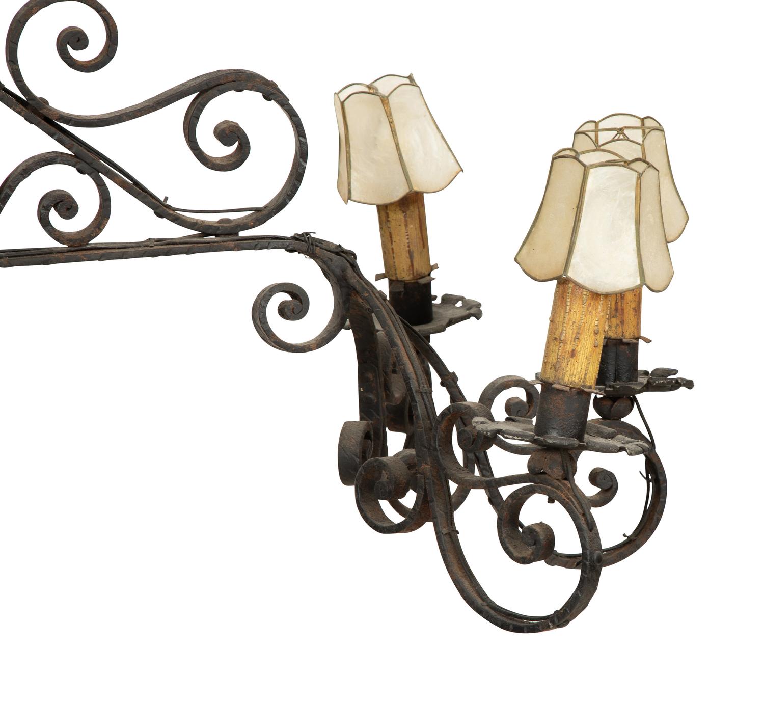 A Mizner Wrought Iron Twelve-Light Billiard Chandelier
