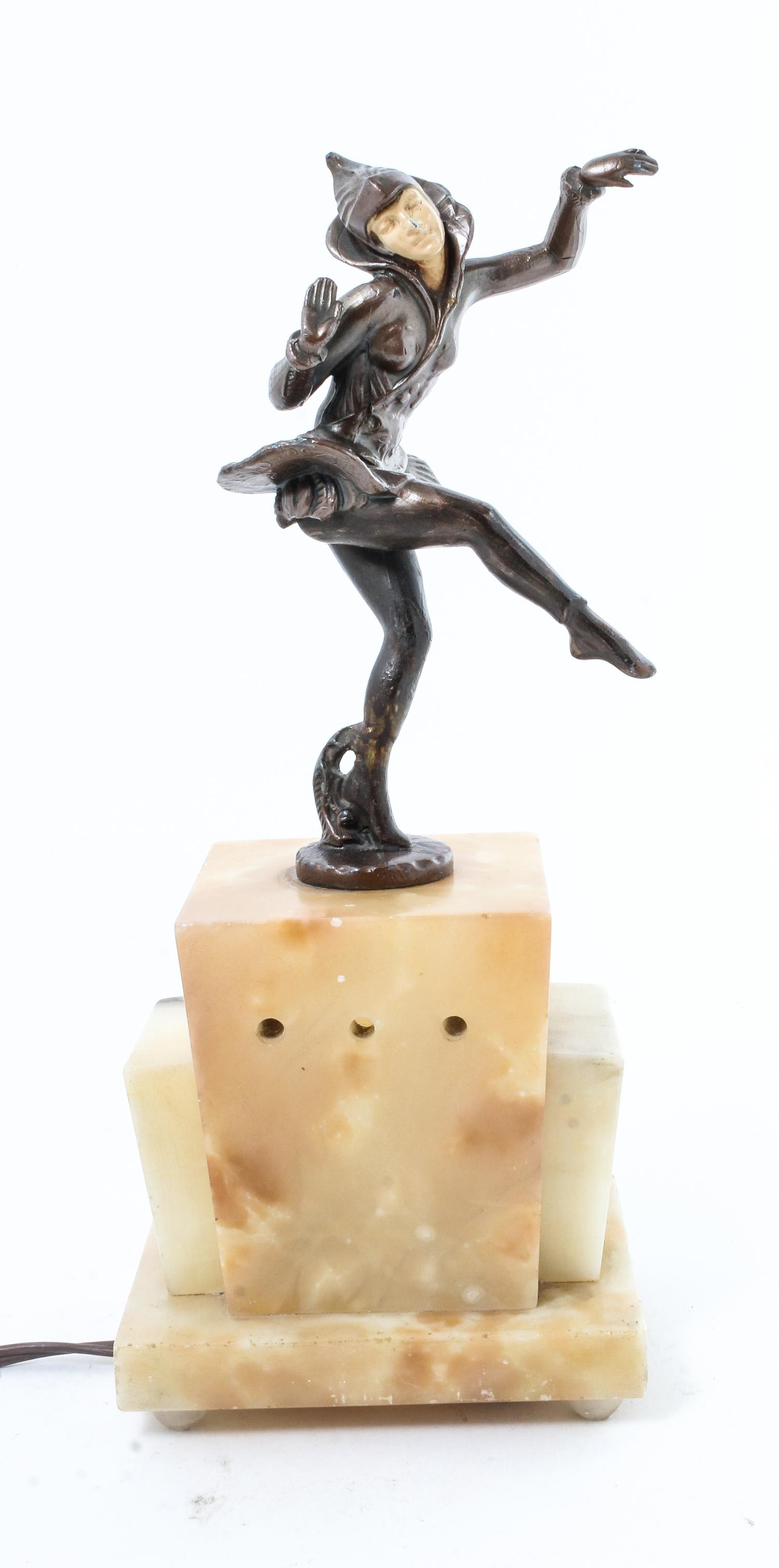 An Art Nouveau Cast Metal and Onyx Lumineer Height overall 13 1/4 inches.
