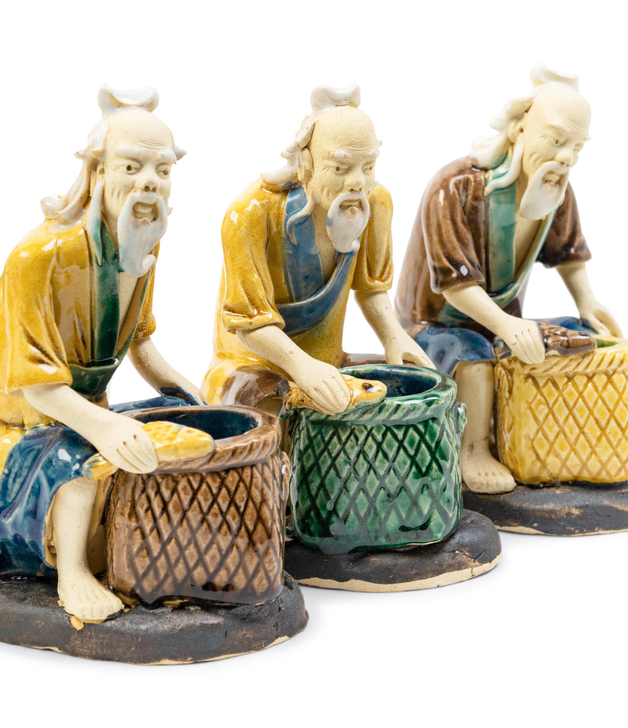 Eight Chinese Polychrome Enameled Pottery Figures
