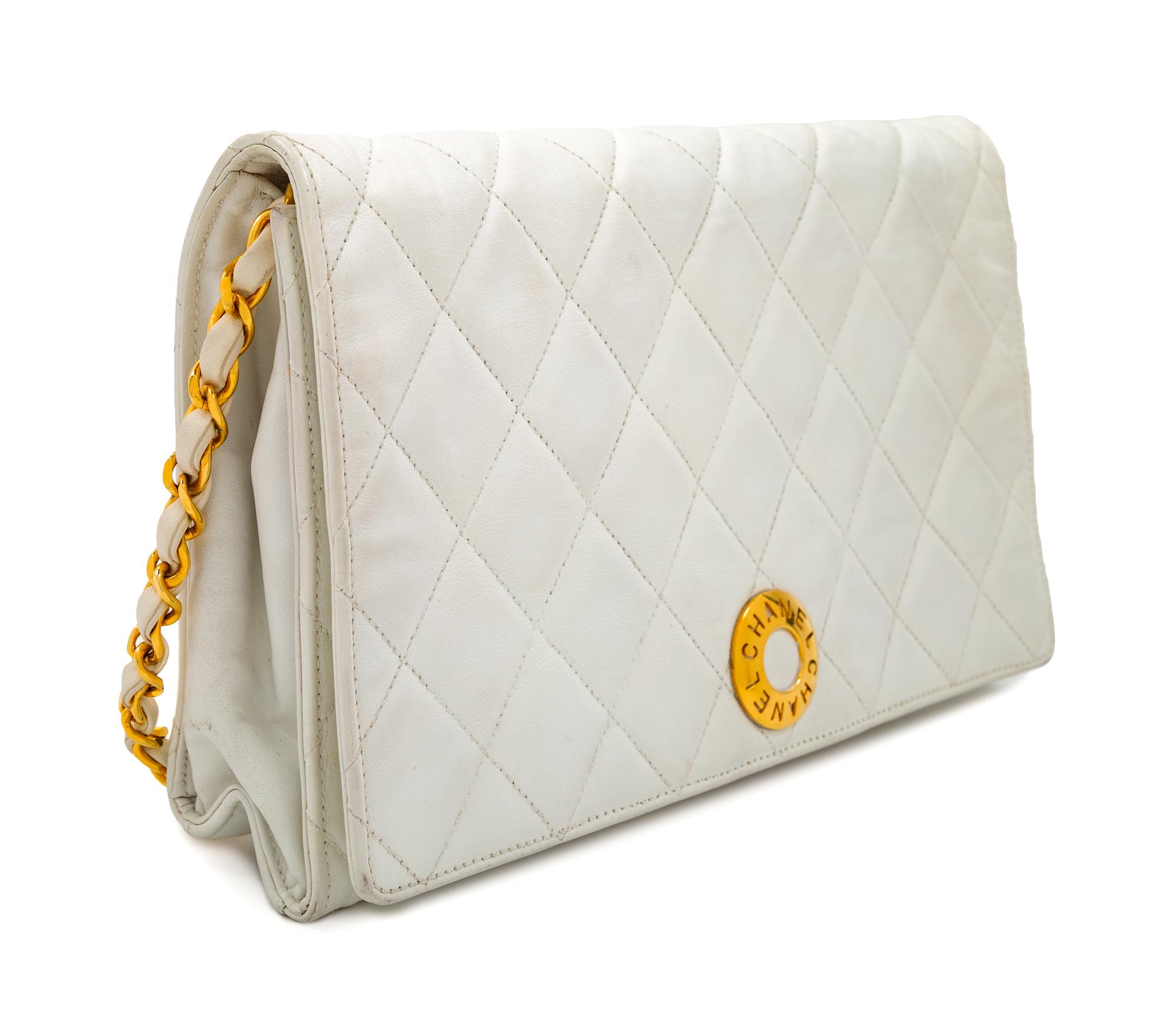 A Chanel White Lambskin Flap Clutch/Bag, 7" H x 10" W x 2" D; Strap drop: 17".