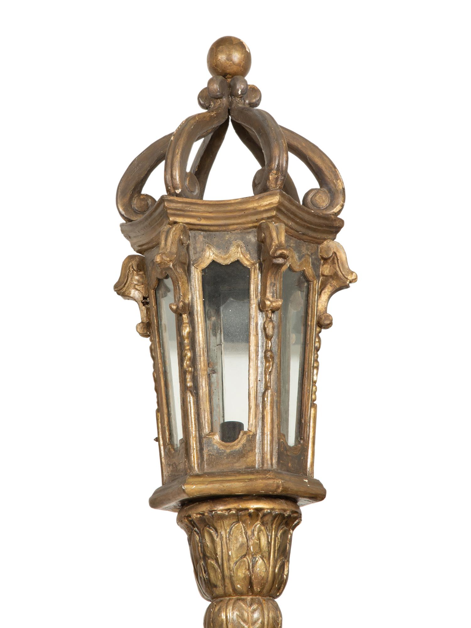 A Pair of Venetian Painted and Parcel Gilt Gondola Lanterns in Marblelized Bases