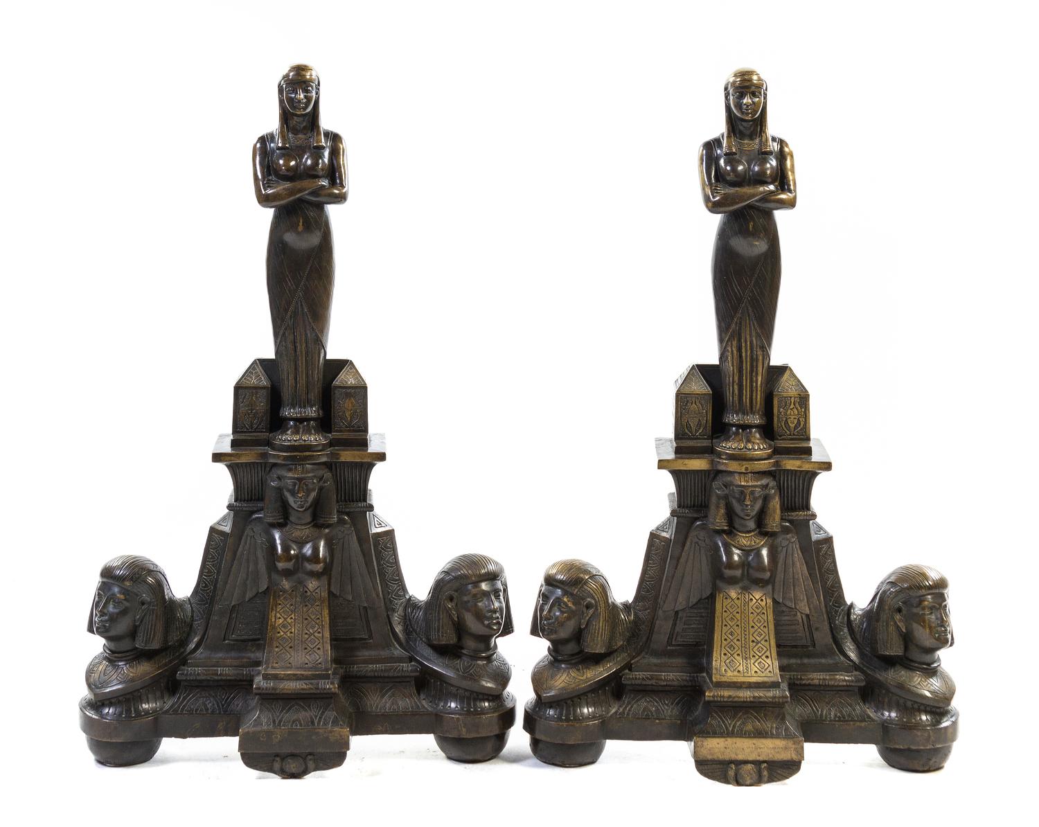 A Pair of Egyptian Revival Bronze Andirons, Height 39 inches.