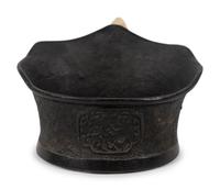 A Chinese Silk Iron with a Figural Handle