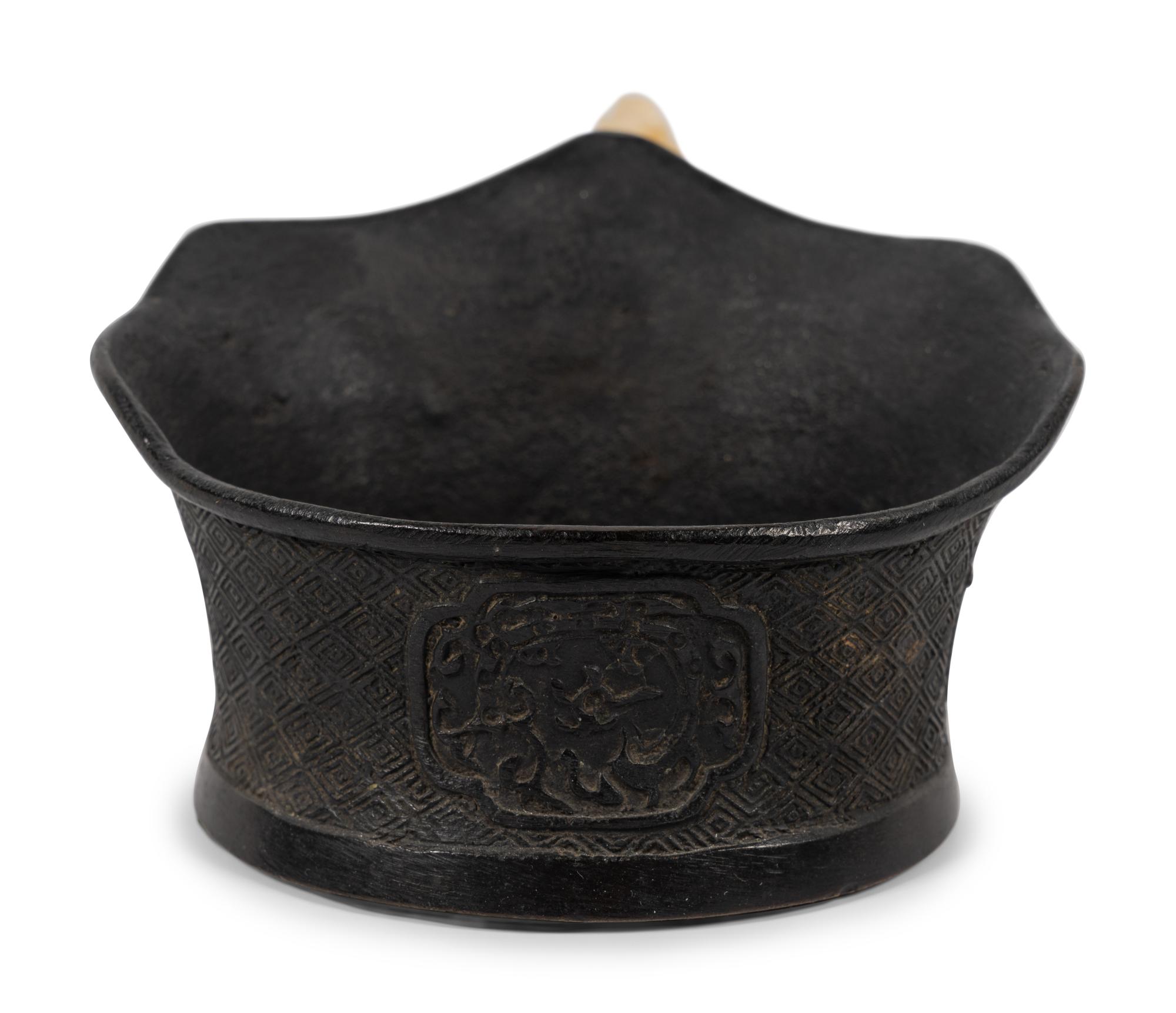 A Chinese Silk Iron with a Figural Handle