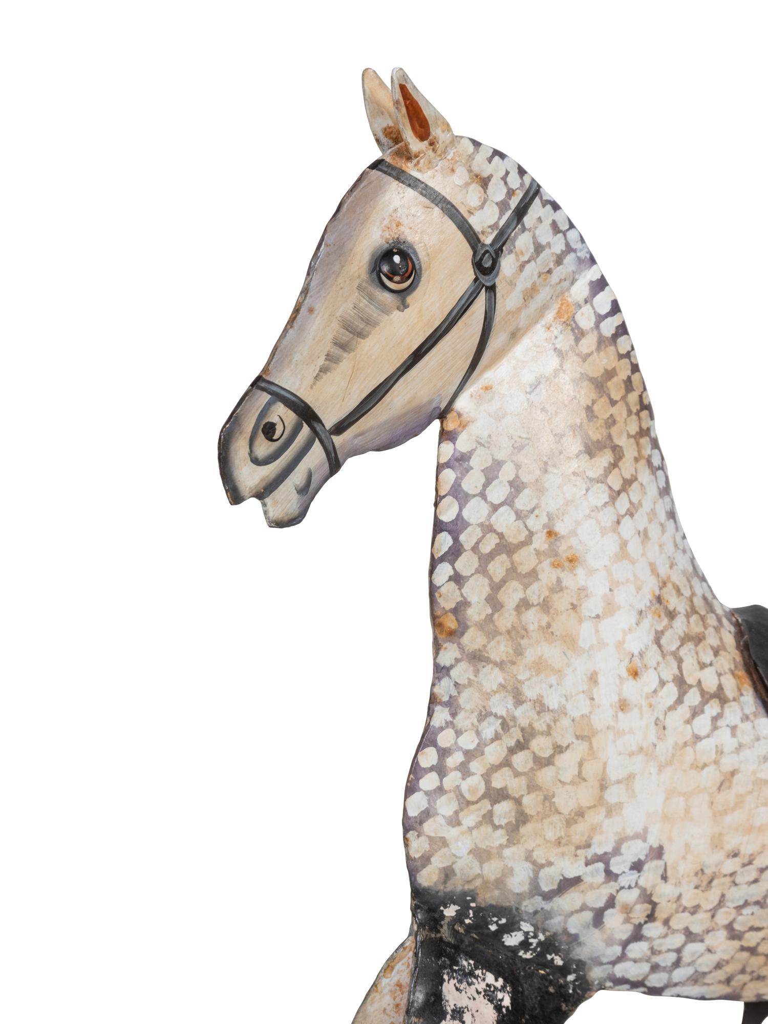 A Paint Decorated Rocking Horse and a Carved Rocking Horse