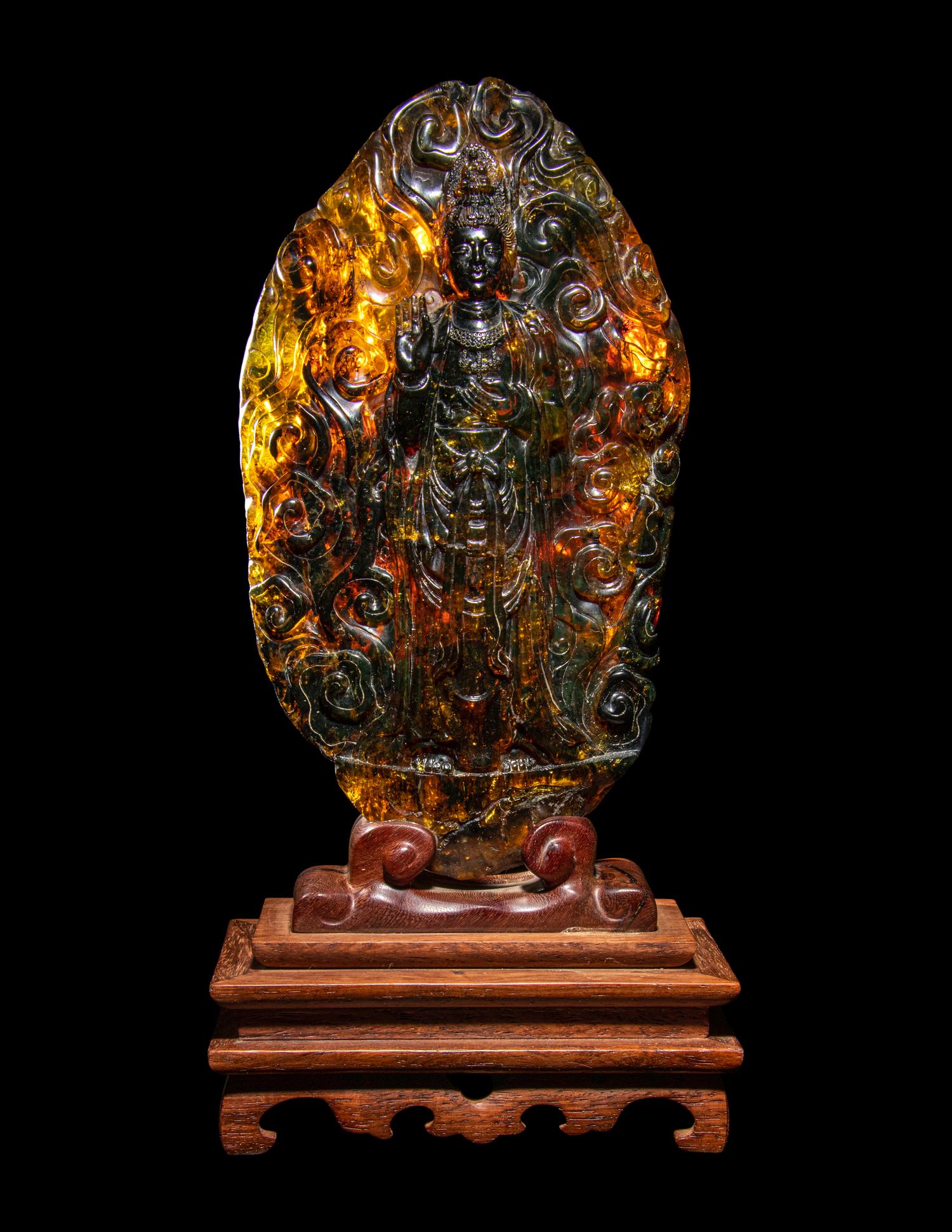 A Chinese Carved Amber Carving of Guanyin