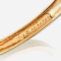 An eighteen karat gold and gem-set bangle, Van Cleef & Arpels