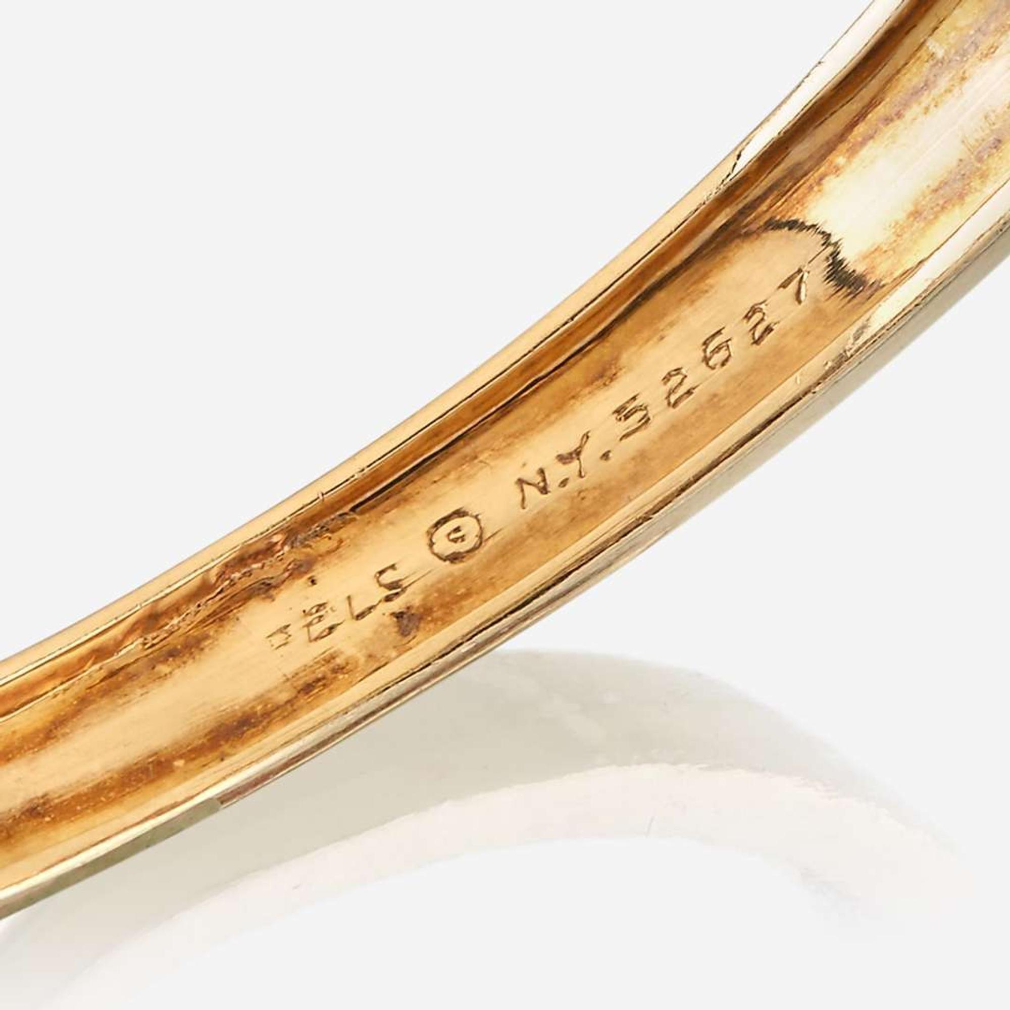 An eighteen karat gold and gem-set bangle, Van Cleef & Arpels