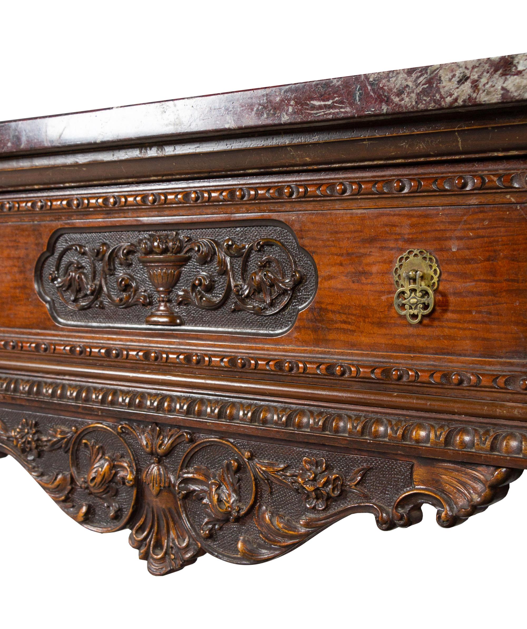 An Italian Carved Walnut Marble-Top Server