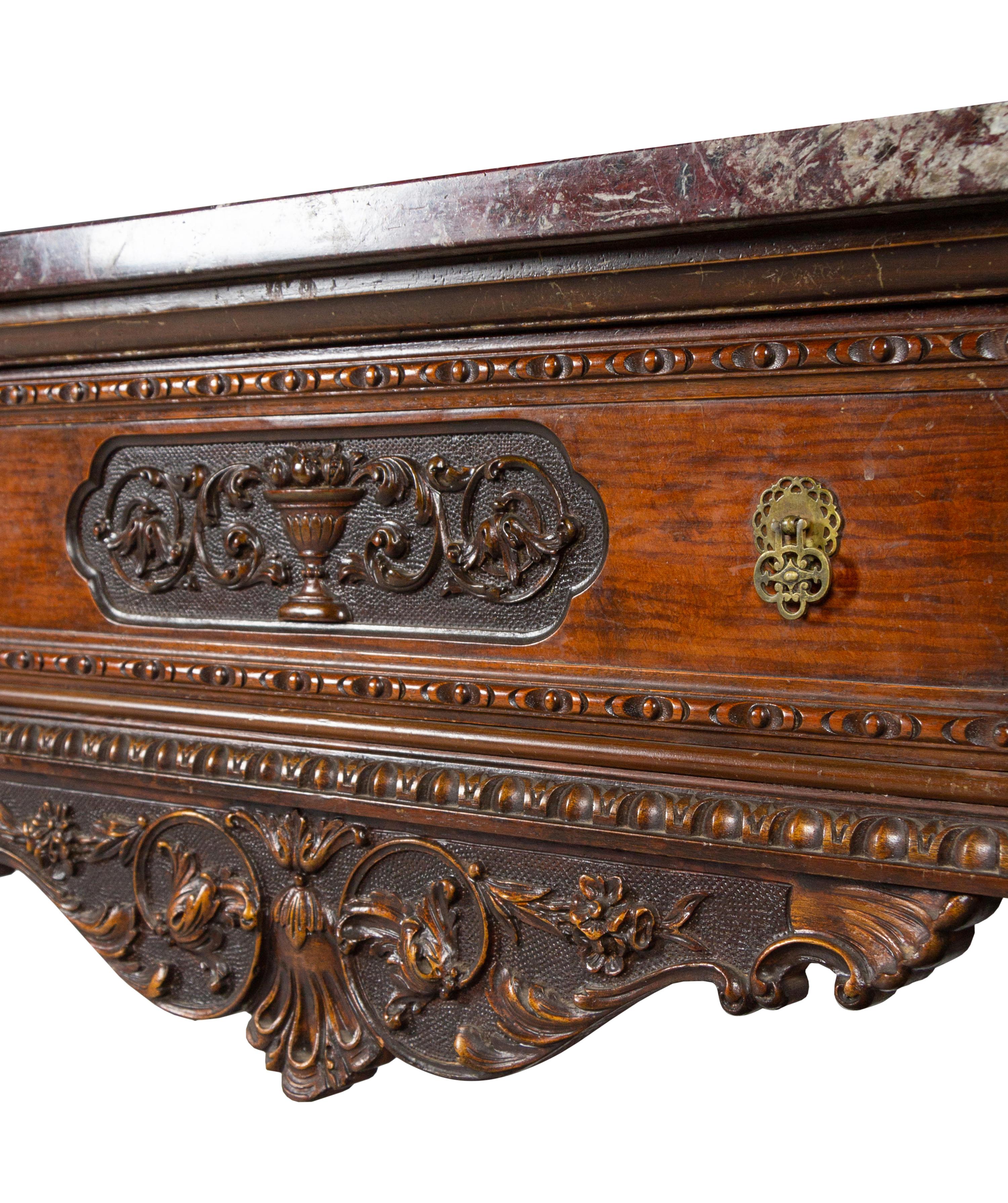 An Italian Carved Walnut Marble-Top Server