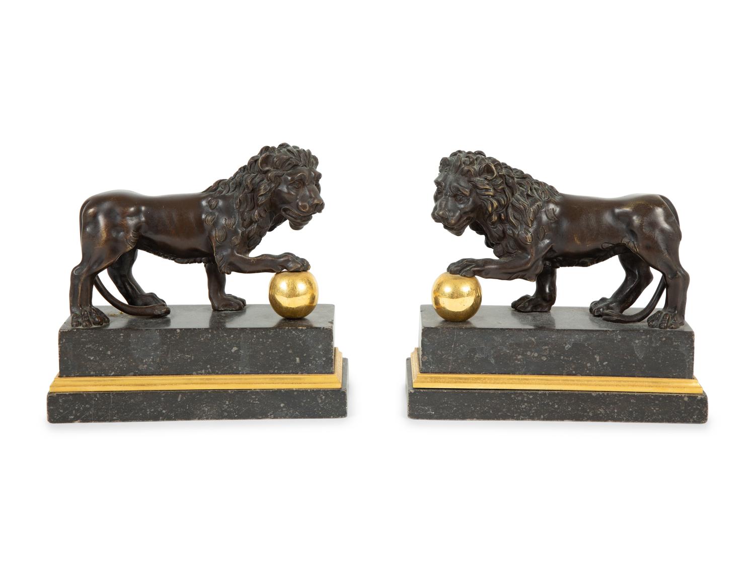 A Pair of Continental Patinated and Gilt Bronze Medici Lions