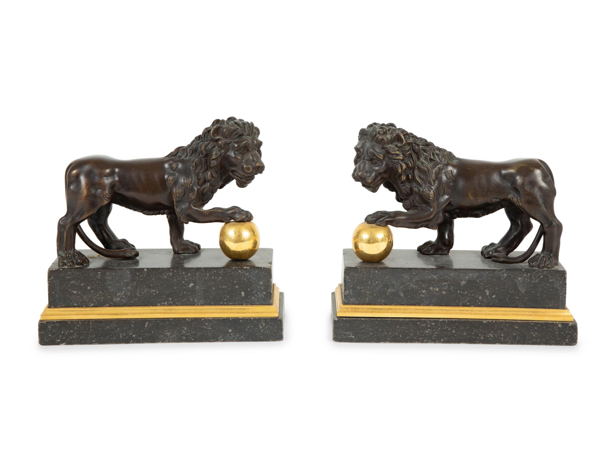 A Pair of Continental Patinated and Gilt Bronze Medici Lions
