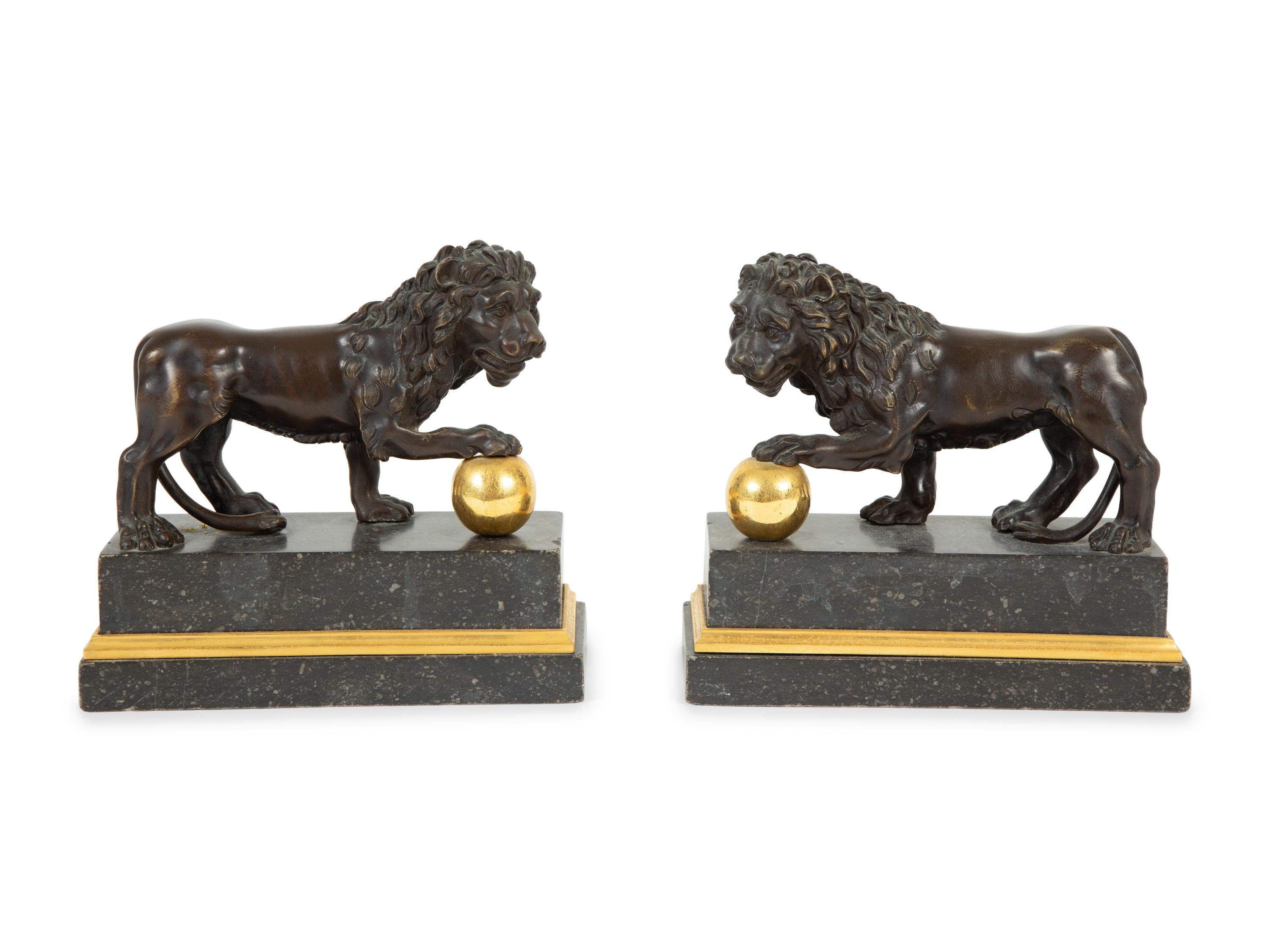 A Pair of Continental Patinated and Gilt Bronze Medici Lions