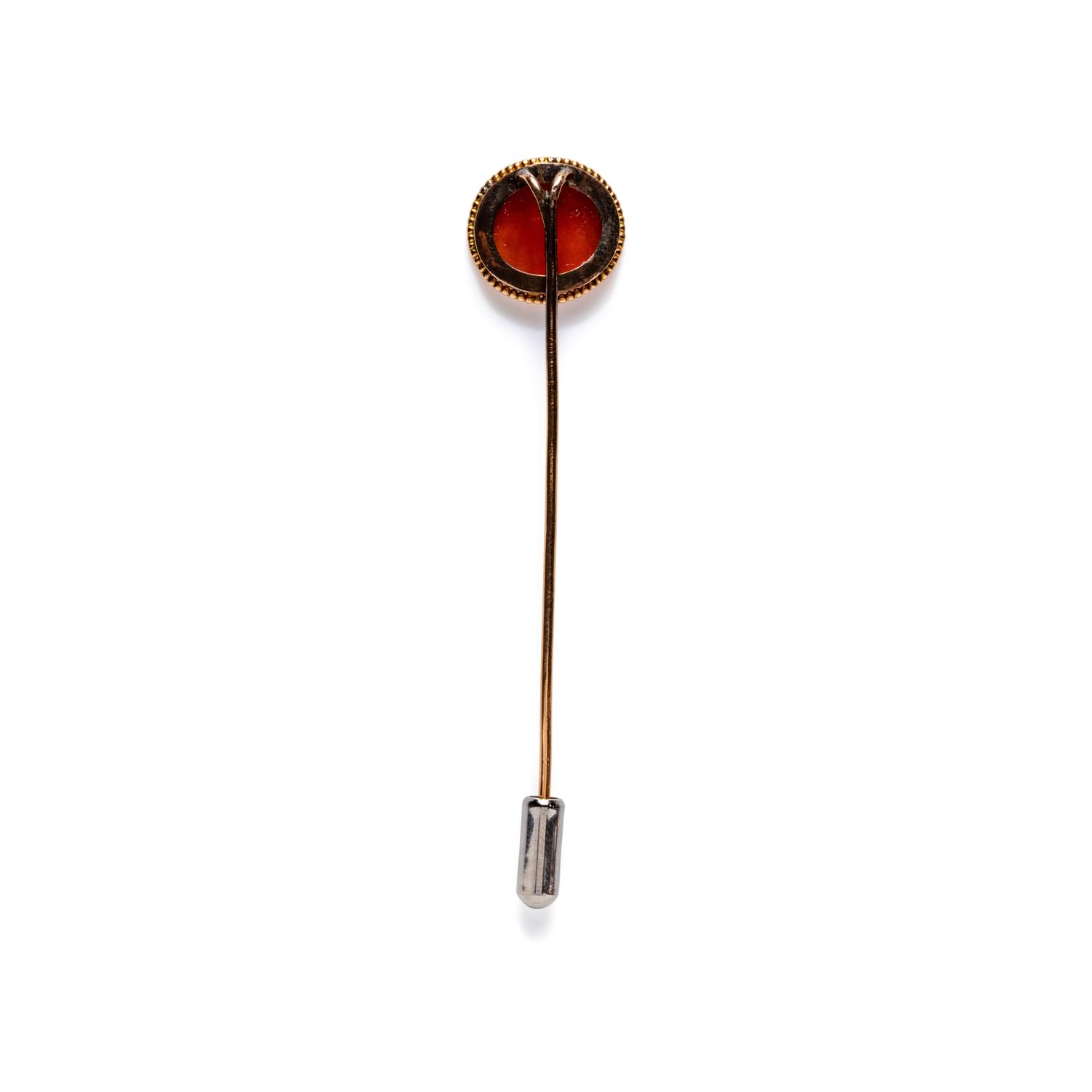 A Roman Carnelian Intaglio with Two Erotes Flanking a Tropaion — Set in a 19th century gold pin