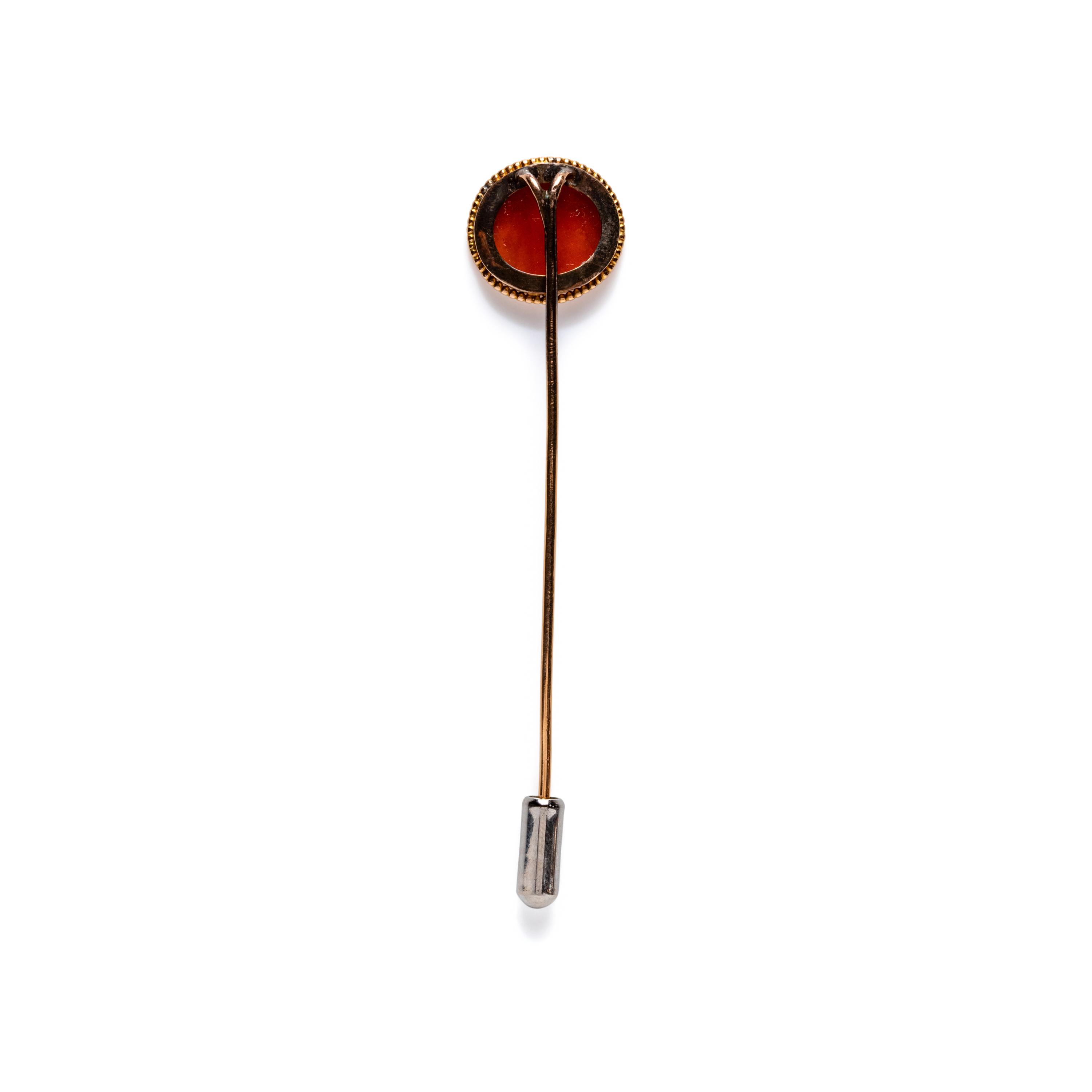A Roman Carnelian Intaglio with Two Erotes Flanking a Tropaion — Set in a 19th century gold pin