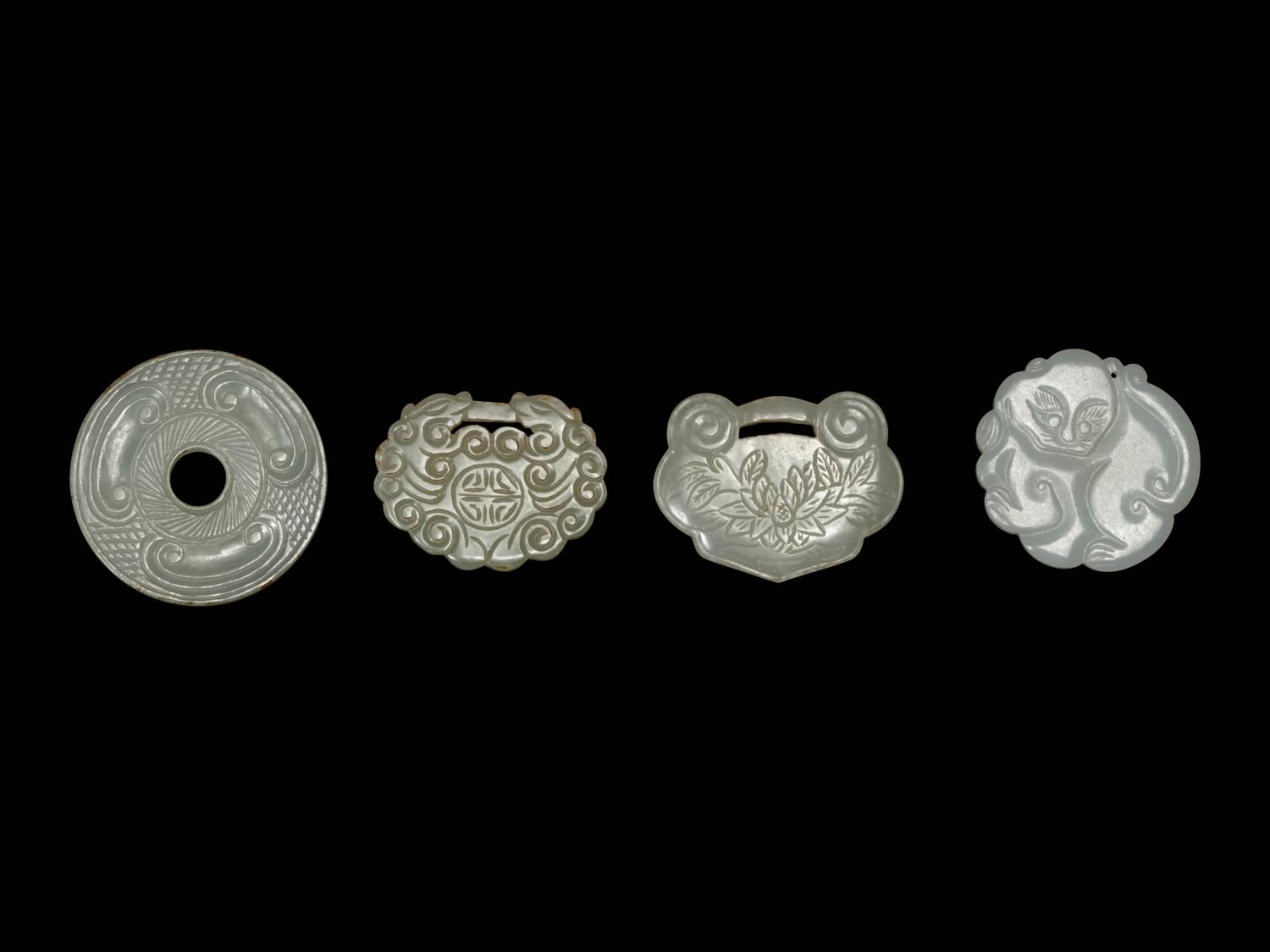 Four Chinese White Jade Pendants