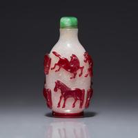 A Chinese Ruby Overlay 'Eight Horses of Wang Mu' Snuff Bottle, 19th Century 清中期 雪霏地套寶石紅料穆王八駿鼻烟壺