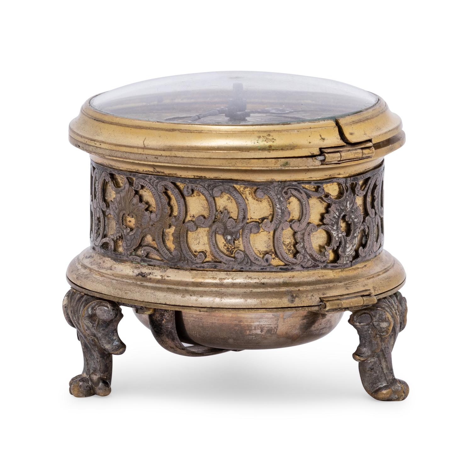 A German Gilt Metal and Silvered Brass Table Clock