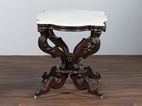 A Renaissance Revival Carved Walnut Marble Top Center Table