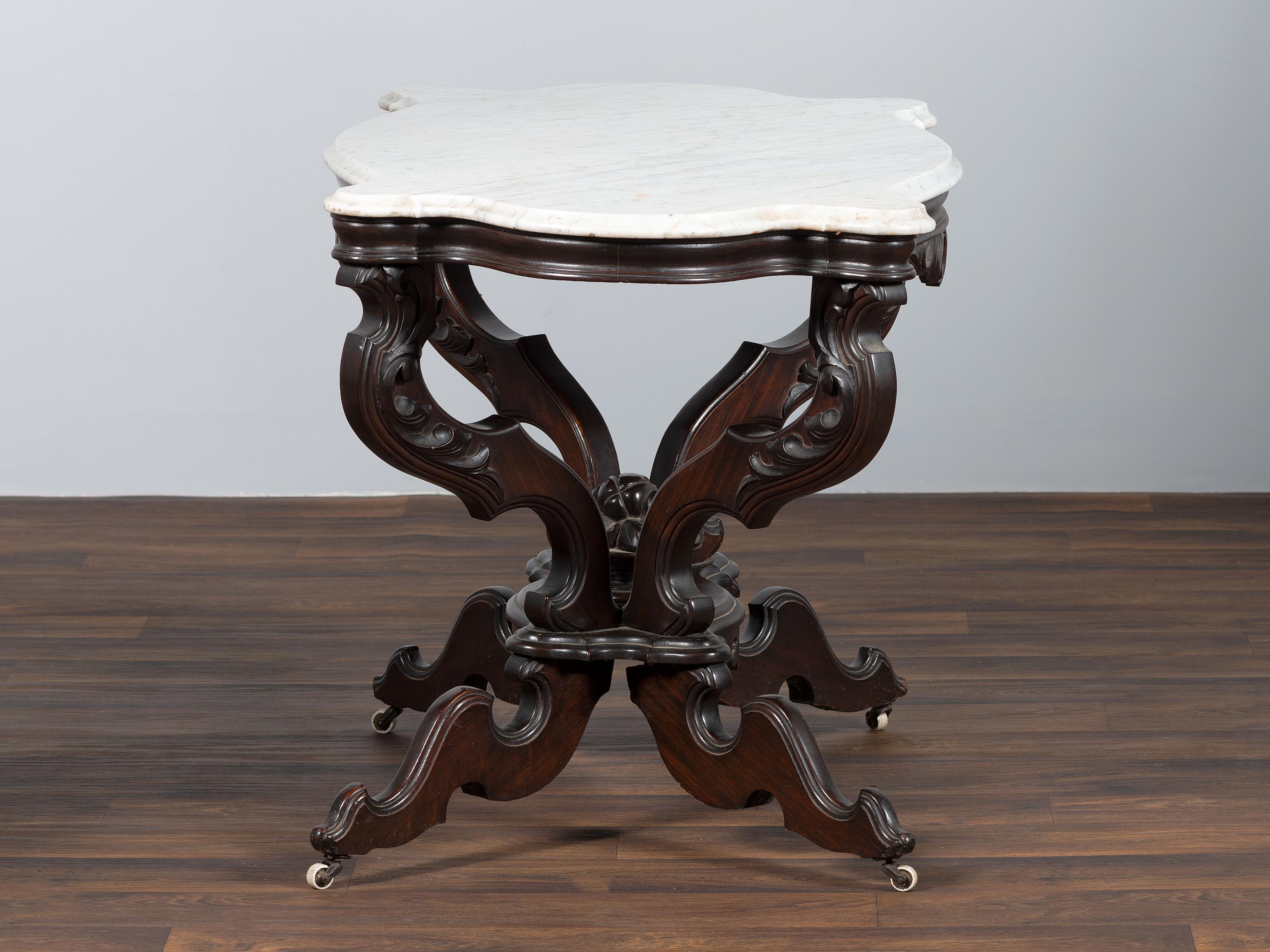 A Renaissance Revival Carved Walnut Marble Top Center Table