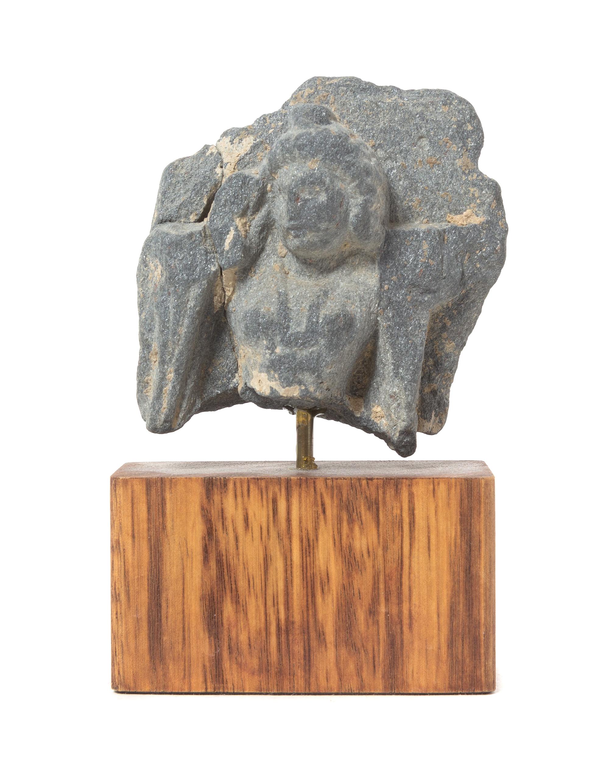 A Gandharan Gray Schist Stone Fragment Height 2 3/4 inches.