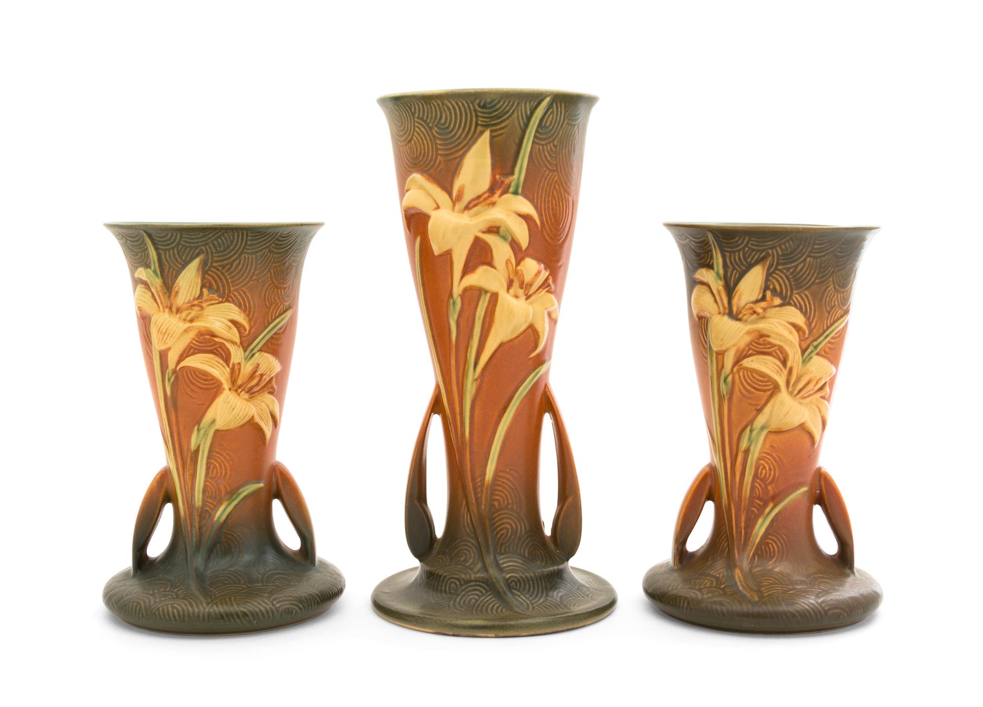 Three Roseville Zephyr Lily Pottery Vases Height of first 12 1/4 inches, pair 9 1/4 inches.