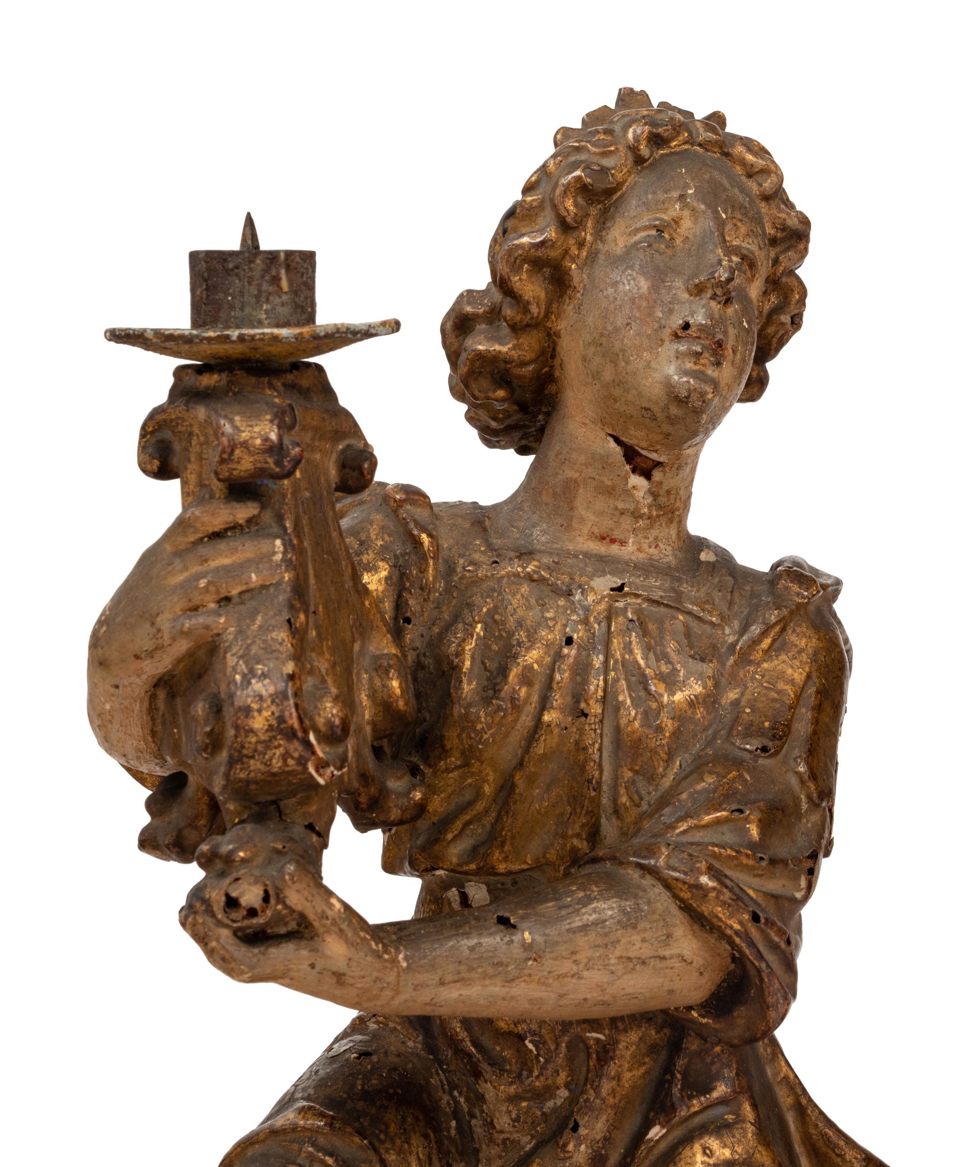 A Pair of Continental Giltwood Figural Altar Candlesticks