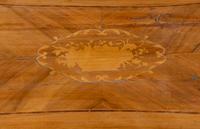 An Italian Walnut and Fruitwood Center Table