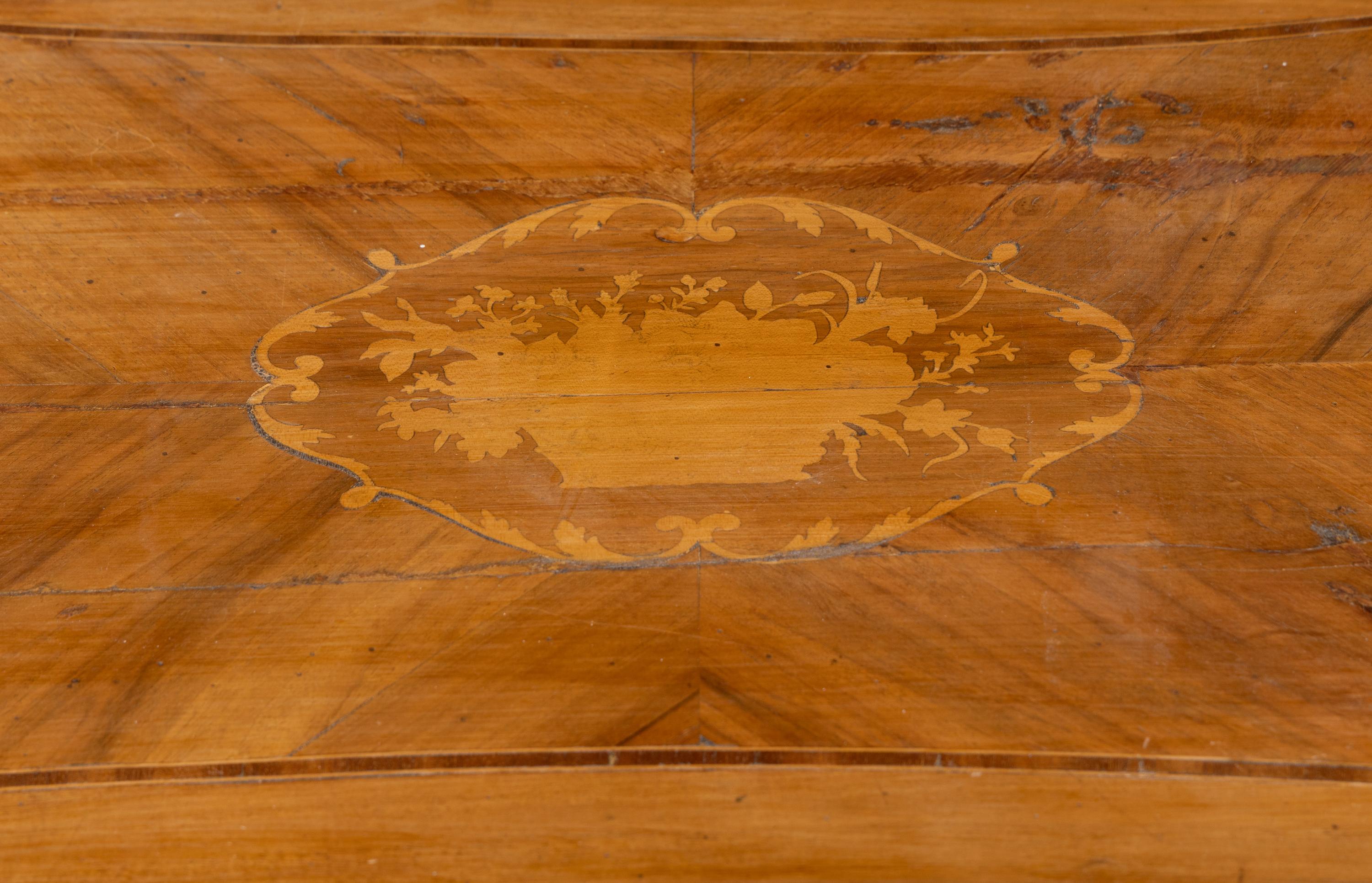 An Italian Walnut and Fruitwood Center Table