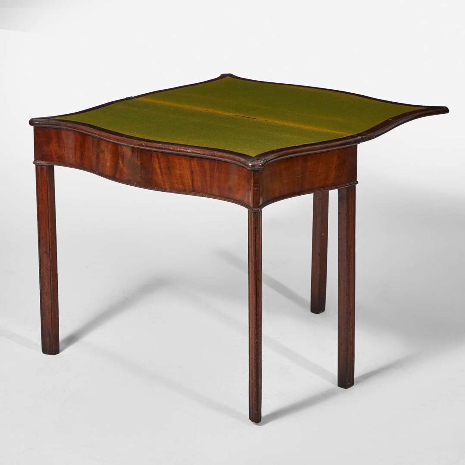 A George III serpentine carved mahogany card table circa 1770