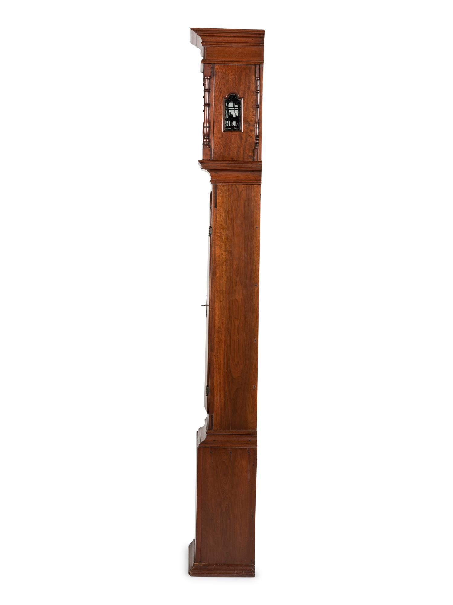 A Queen Anne Walnut Tall Case Clock