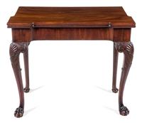 A George III Mahogany Concertina-Action Flip-Top Game Table Height 28 x width 32 1/2 x depth 16 1/2 inches (closed). — PROBABLY IRISH, 18TH/19TH CENTURY
