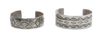 Two Traditional Style Navajo Stamped Silver Bracelets Length of larger 5 5/8 x opening 1 3/8 x width 1 inches.