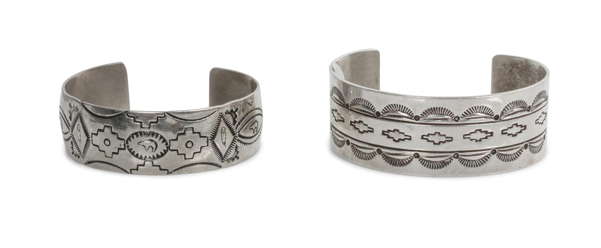 Two Traditional Style Navajo Stamped Silver Bracelets Length of larger 5 5/8 x opening 1 3/8 x width 1 inches.